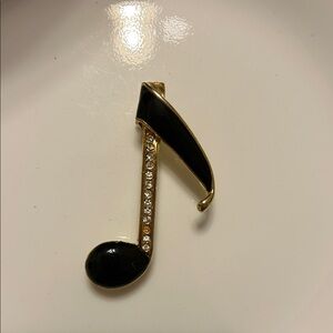 Elegant Black and Gold Musical Note Pendant